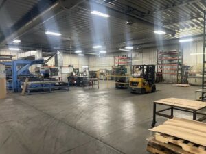 a large warehouse with a yellow truck